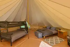 Bell tent with a double bed, triple bunk bed and camp bed (bedding and towels)