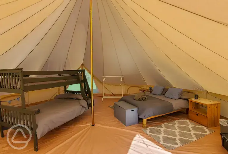 Bell tent with a double bed, triple bunk bed and camp bed (bedding and towels)