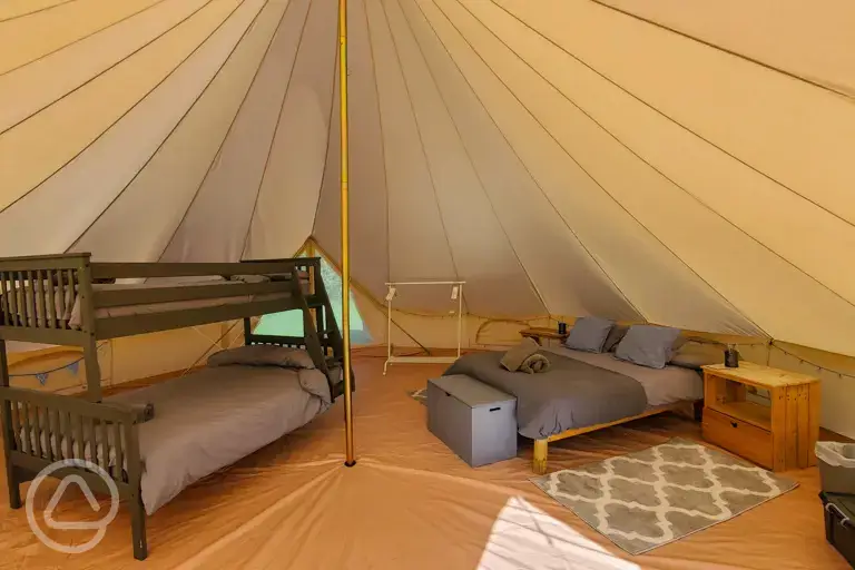 Bell tent with a double bed, triple bunk bed and camp bed (bedding and towels)