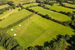 Aerial of the glamping field at Hale Farm Campsite