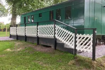Henrietta Train Carriage fenced off area at Eden Valley Glamping