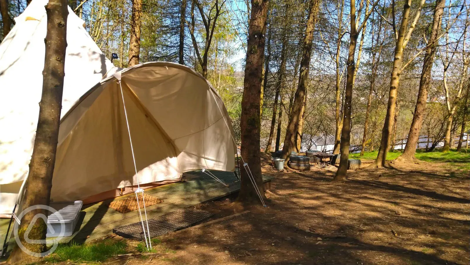 Glamping tent and fire pit area