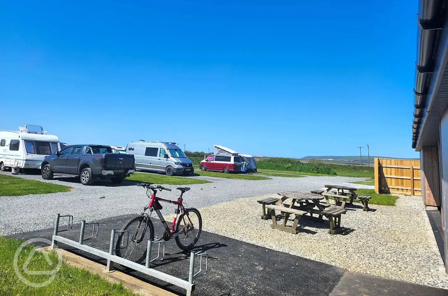 Electric hardstanding pitches and nearby bike rack