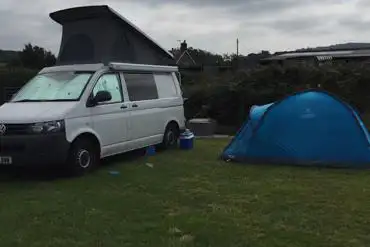 Campervan and tent grass pitch