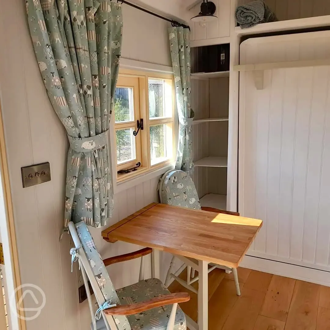 Shepherd's hut dining area