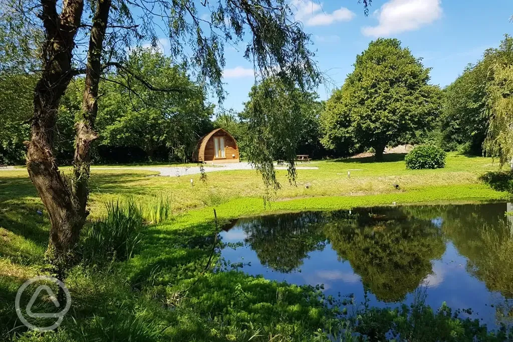 Ensuite Deluxe Wigwam Pods by the wildlife pond