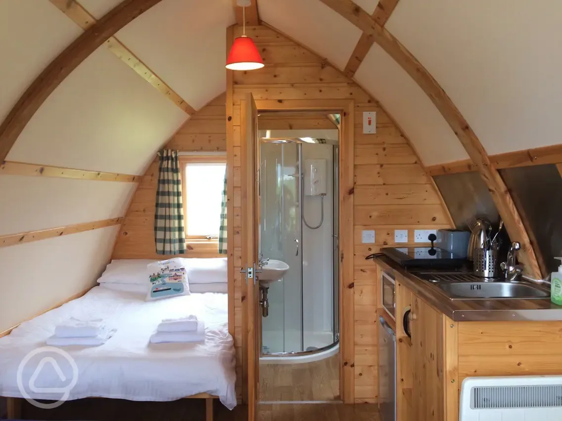 Ensuite Wigwam Interior with double bed and towels provided.