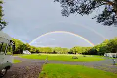 Electric hardstanding pitches overlooking a rainbow at Old Farm Electric hardstanding pitches overlooking a rainbow at Old Farm