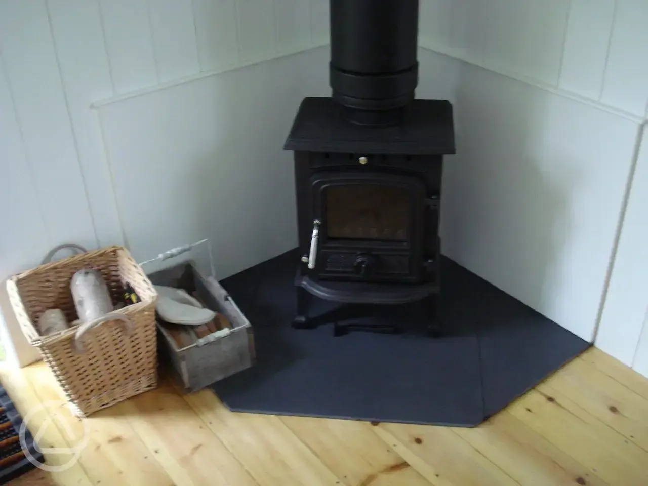 real wood burner with logs provided