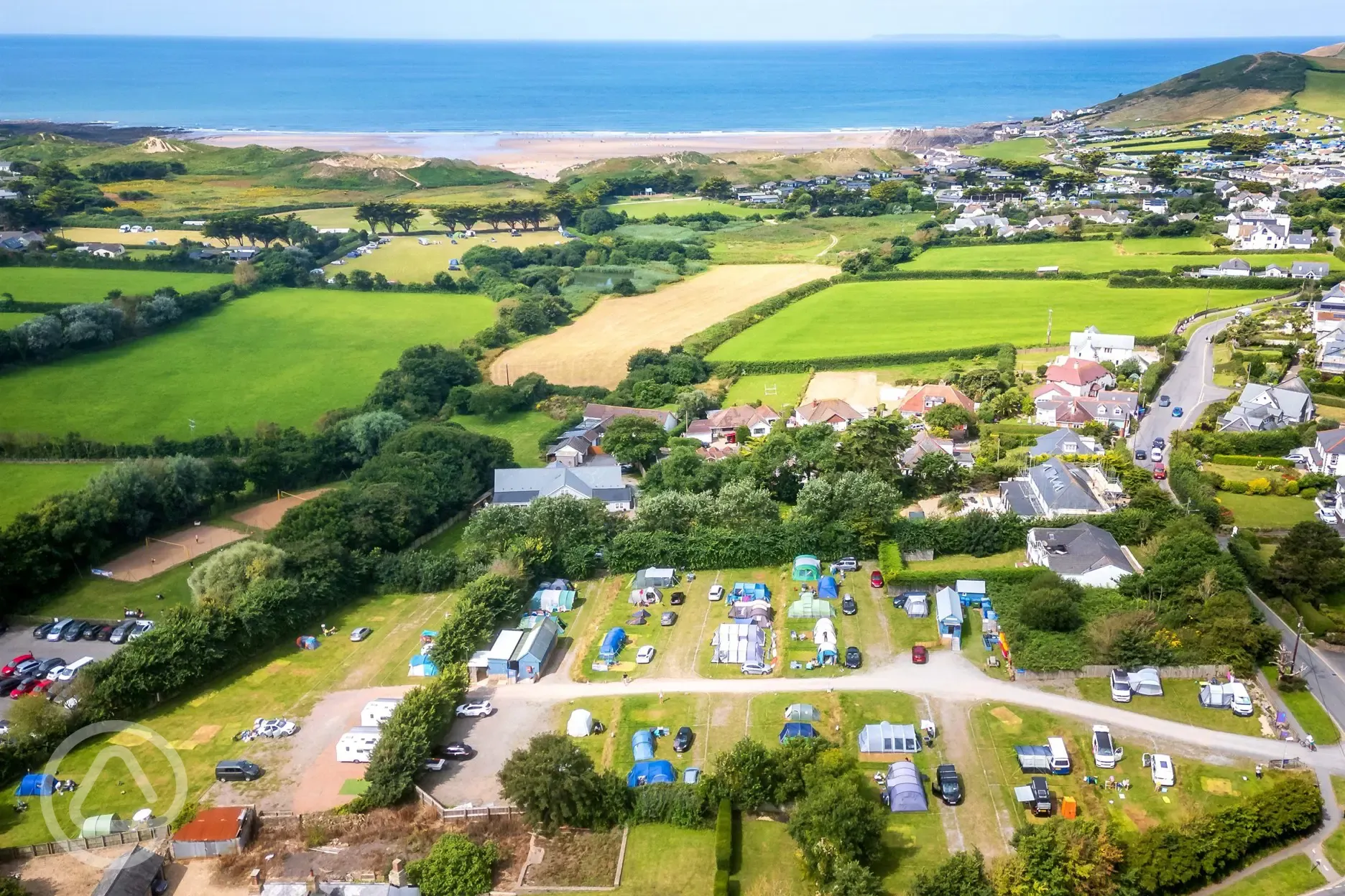 Aerial of campsite by the beach