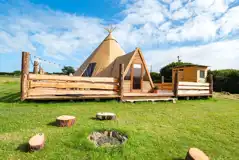Piran Kata tipi with an outdoor fire pit area