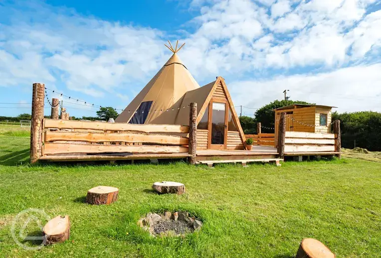 Piran Kata tipi with an outdoor fire pit area