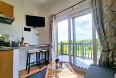 Studio pod cabin TV and lounge area