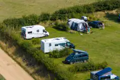 Serviced grass pitches for tents, campervans, caravans, motorhomes and RVs
