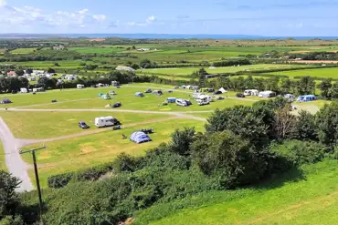 Aerial of the site and views to Saunton Sands