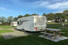 Hardstanding pitches with optional electric (Manorbier) and a grass area