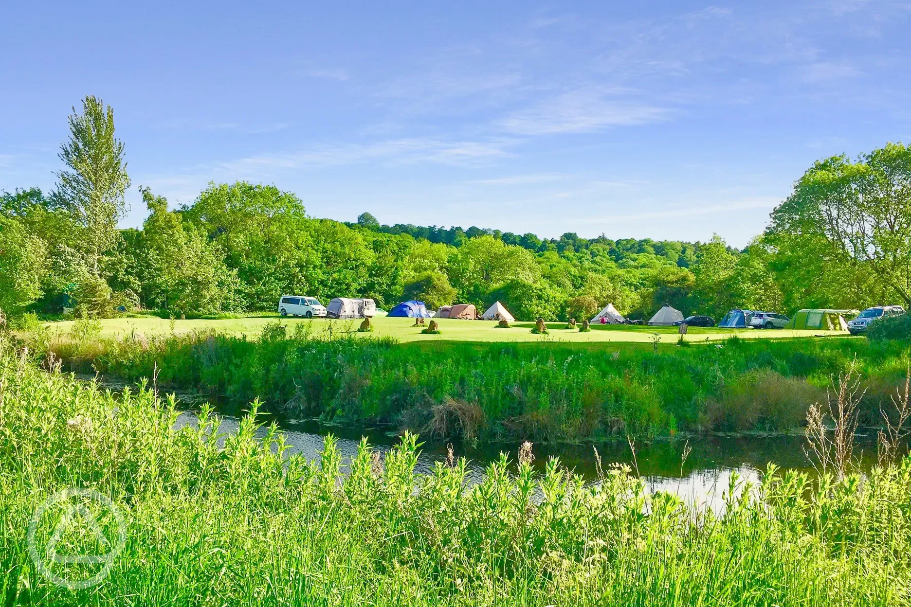 Grass pitches by the river