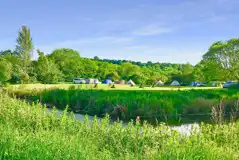 Grass pitches by the river