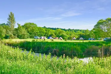 Grass pitches by the river