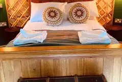 Yurt with a double bed and bedding