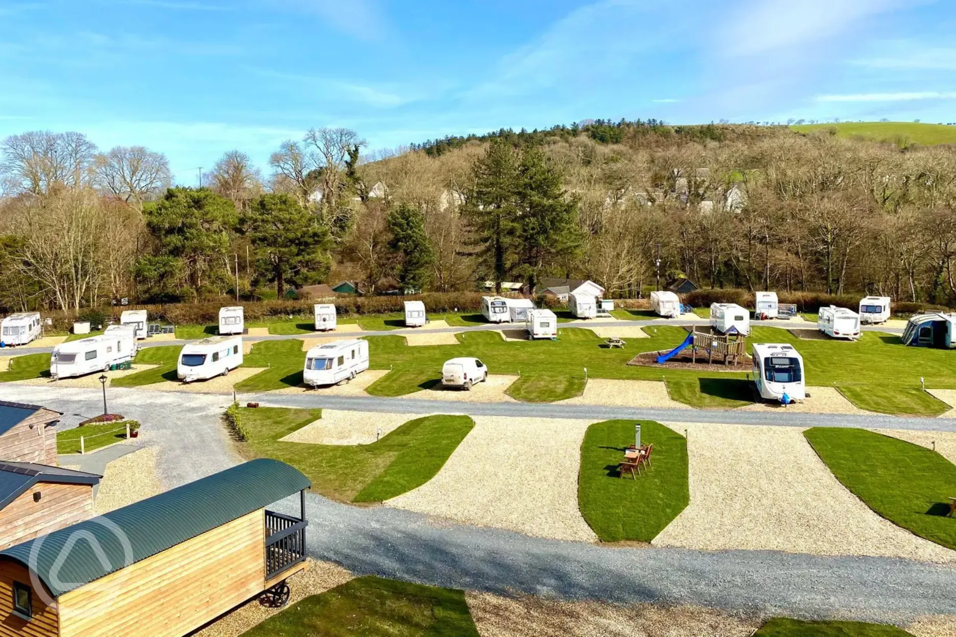 Electric hardstanding pitches next to kids playground