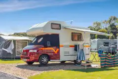 Campervan on an electric gravel hardstanding pitch Campervan on an electric gravel hardstanding pitch