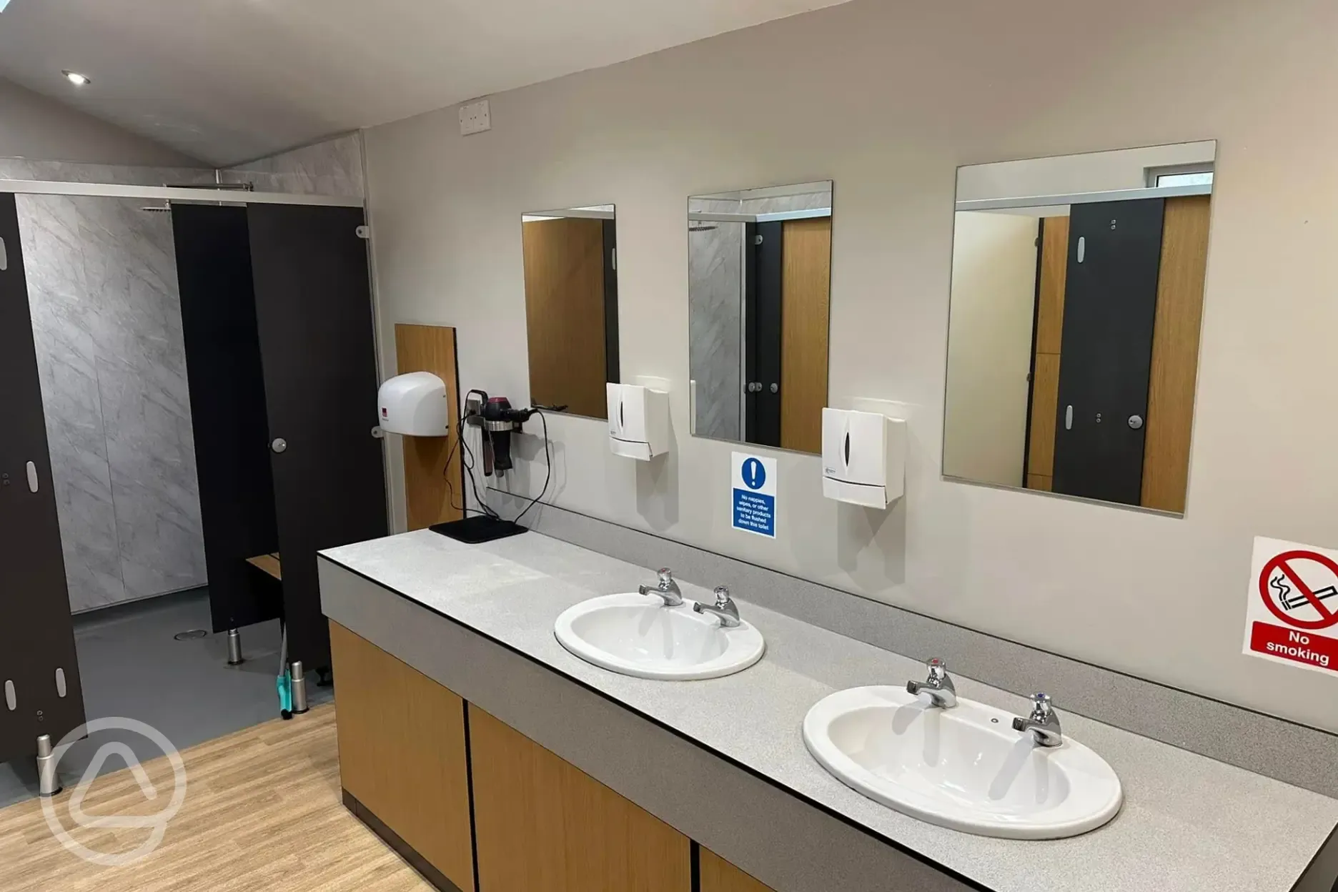 Shower block with hair dryers and mirrors