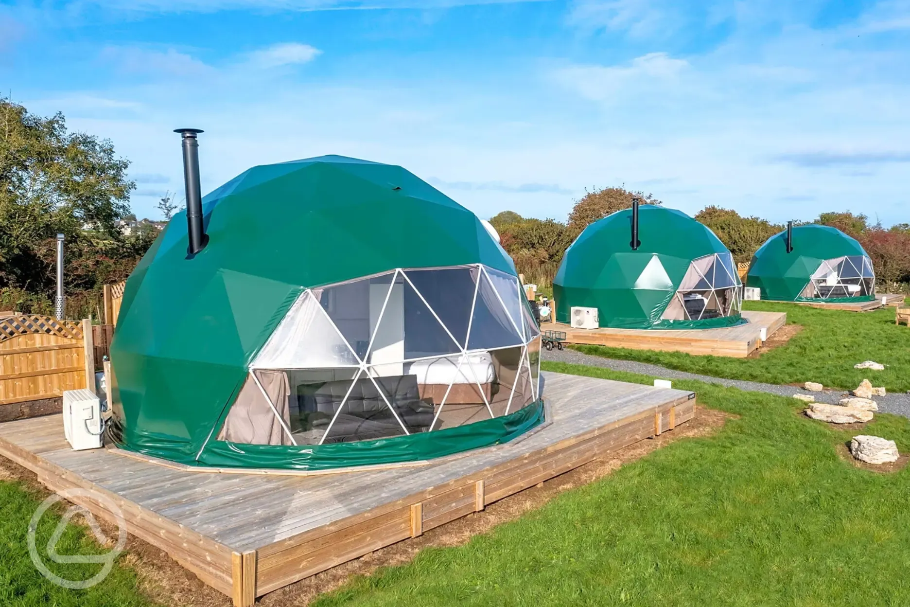 Geodomes with private bathroom cabins and wood-fired hot tubs