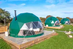 Geodomes with private bathroom cabins and wood-fired hot tubs Geodomes with private bathroom cabins and wood-fired hot tubs