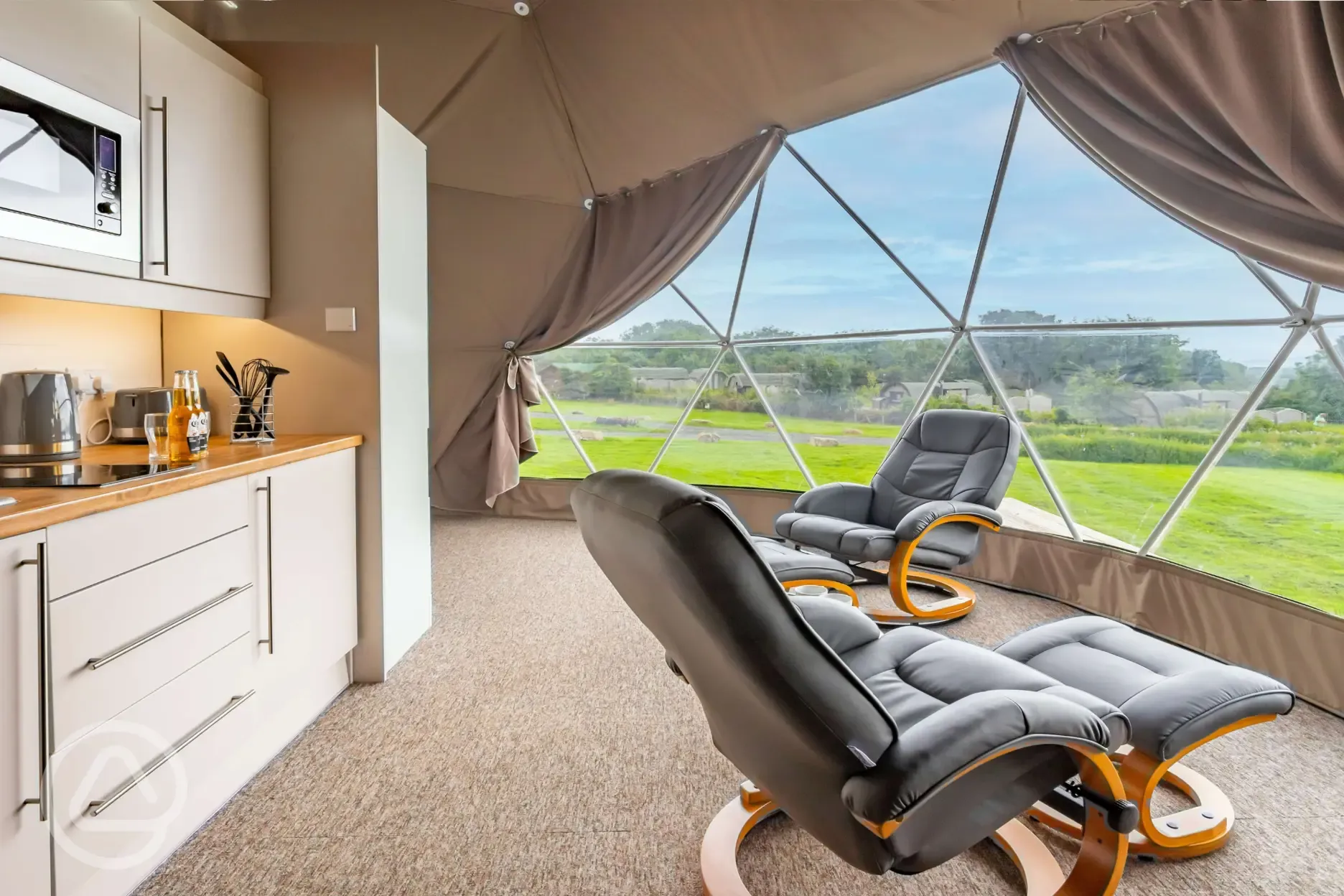 Geodome interior with two leather recliners