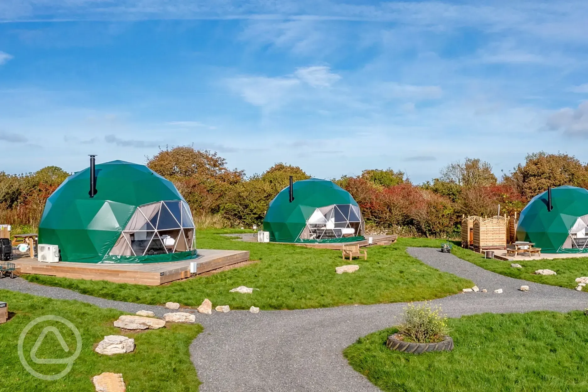 Geodomes with private bathroom cabins and wood-fired hot tubs