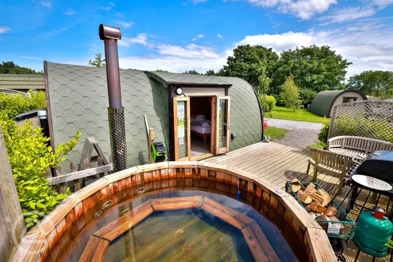 Elite plus ensuite glamping pod with a wood-fired hot tub