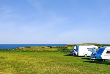 Non electric grass pitches with Anglesey sea views