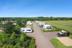 Northern Close with hedges between hardstanding pitches with 16 amp hook ups