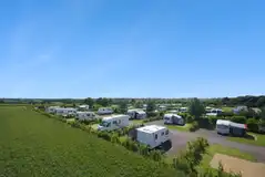 Northern Close with hedges between hardstanding pitches with 16 amp hook ups