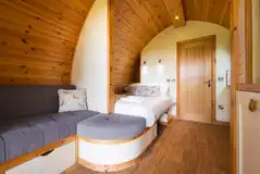 Glamping pod with a sofa and double bed (bedding included)
