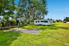 Hardstanding and grass area on the fully serviced pitches Hardstanding and grass area on the fully serviced pitches