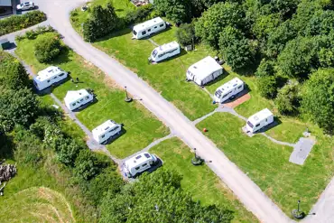 Aerial of the fully serviced hardstanding pitches at Ysgubor Fadog Caravan Site