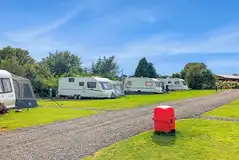 Fully serviced hardstanding and grass pitches with awning space Fully serviced hardstanding and grass pitches with awning space