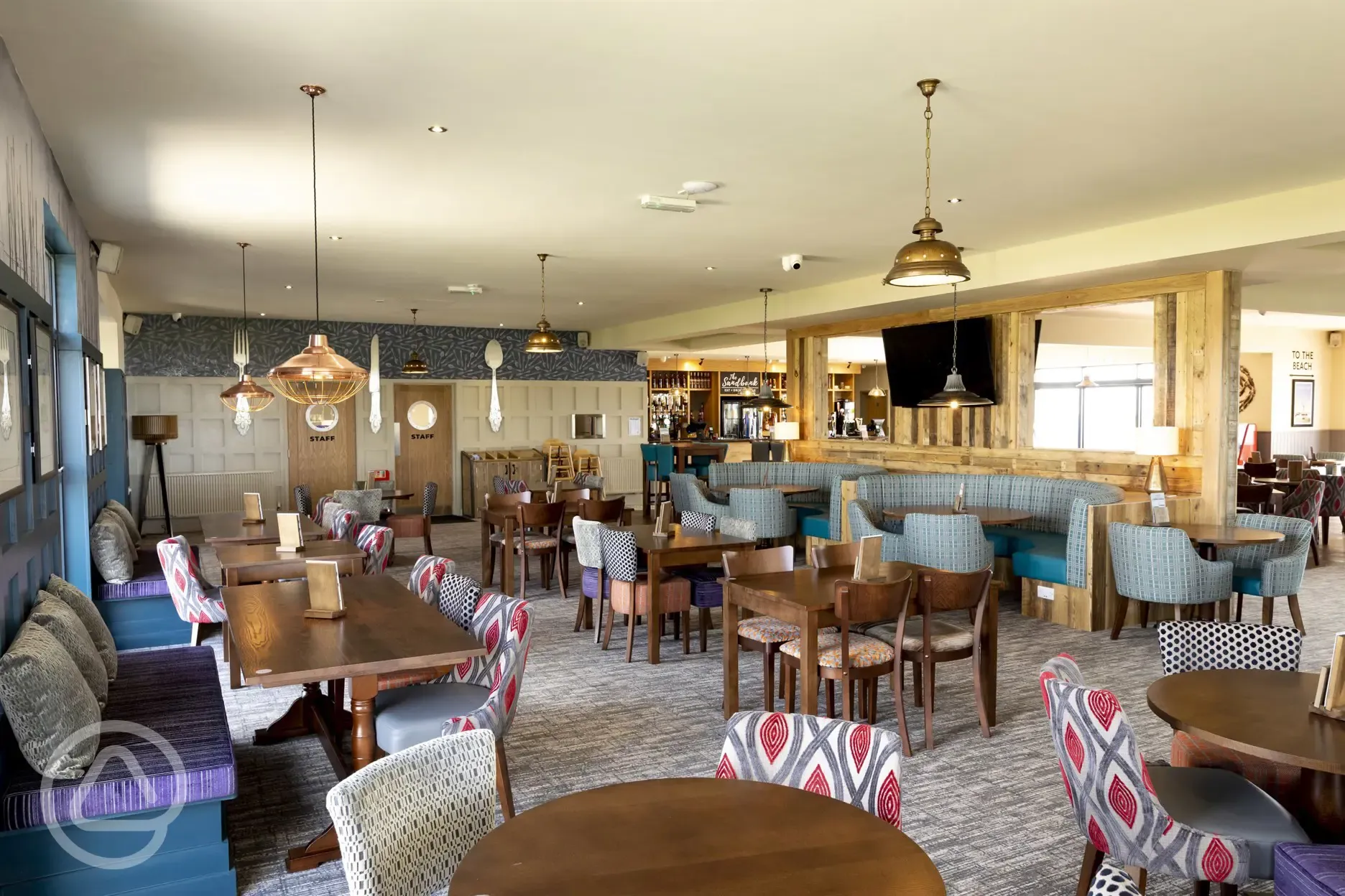 Onsite bar and restaurant interior with seating
