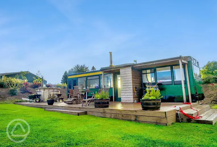 Eco bus (four person) with decking, outdoor furniture, and a hot tub