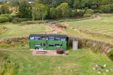 Eco bus (six person) with a hot tub and fire pit circle at The Bus Stop