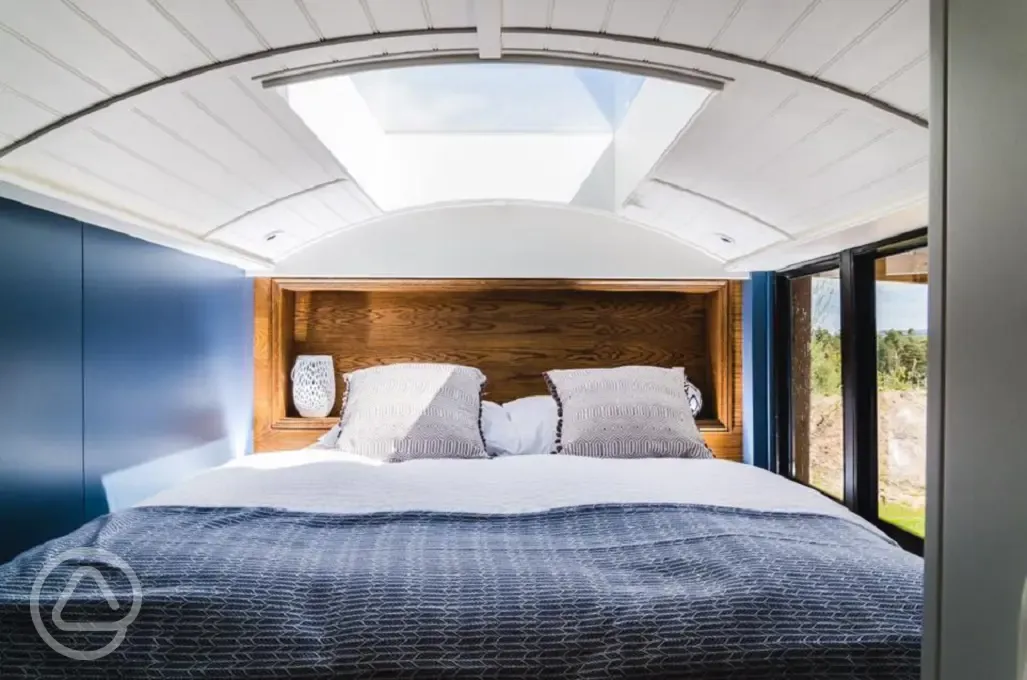 Luxury glamping bus (four person) king size bed with bedding provided
