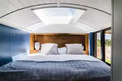 Luxury glamping bus (four person) king size bed with bedding provided
