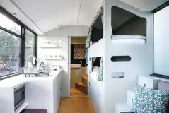 Luxury glamping bus (four person) interior with bunk beds Luxury glamping bus (four person) interior with bunk beds
