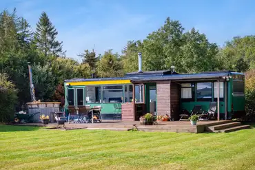 Luxury glamping bus (four person) with decking and outdoor furniture