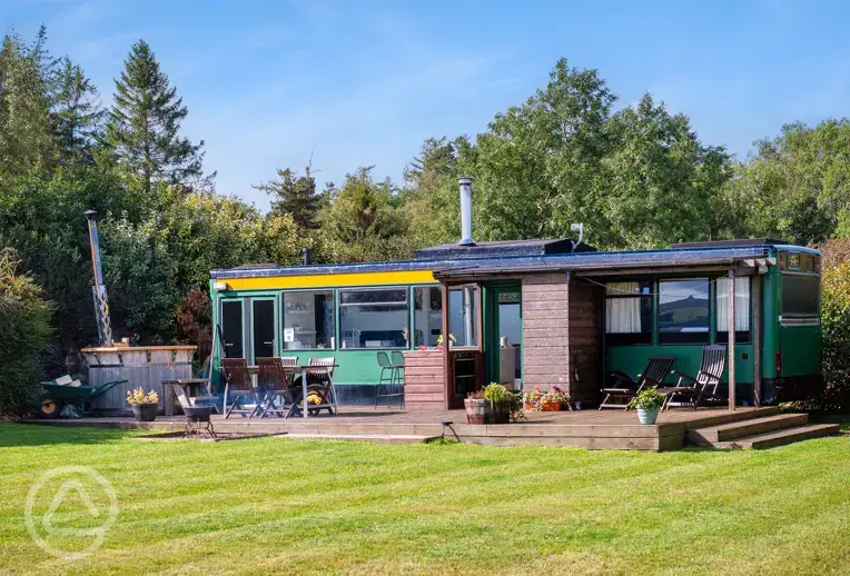 Luxury glamping bus (four person) with decking and outdoor furniture