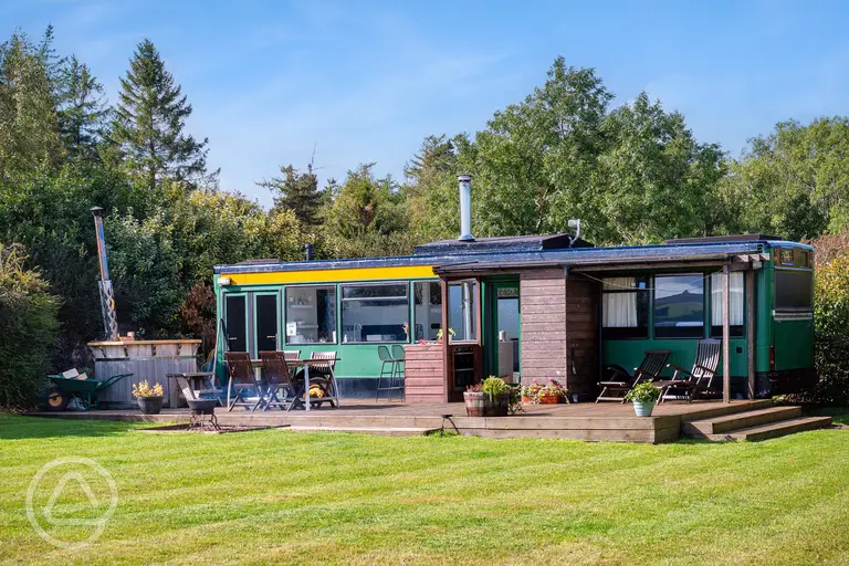 Luxury glamping bus (four person) with decking and outdoor furniture