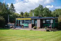 Luxury glamping bus (four person) with decking and outdoor furniture Luxury glamping bus (four person) with decking and outdoor furniture