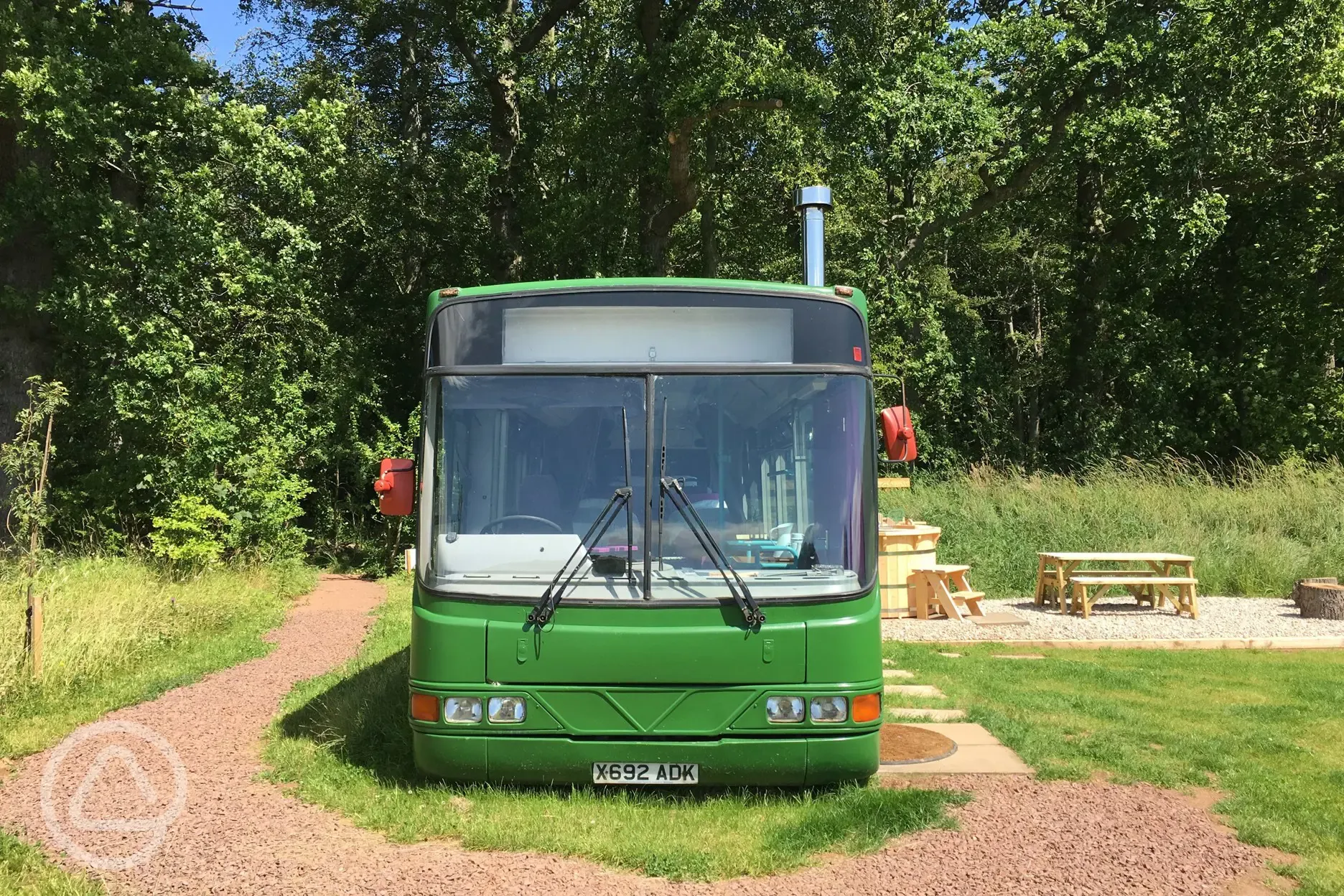 Eco bus (two person) front view with an outdoor seating area